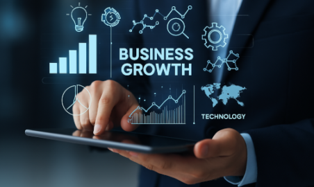 A business professional analyzing data on a tablet with digital technology solutions displayed on the screen.